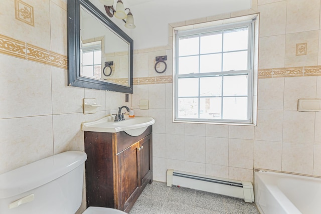 bathroom with baseboard heating, a bathtub, tile walls, and a wealth of natural light