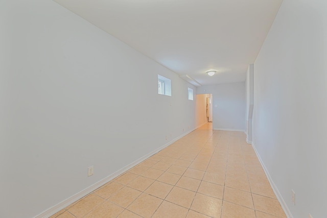 spare room featuring light tile patterned floors