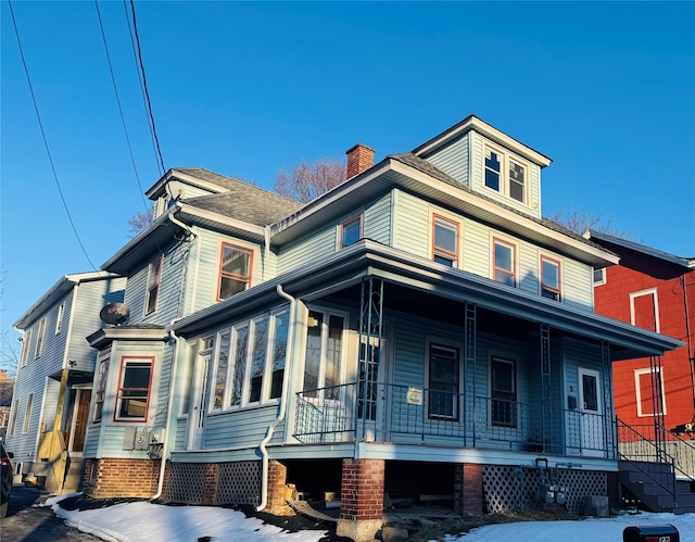 view of front of property featuring a porch and central AC