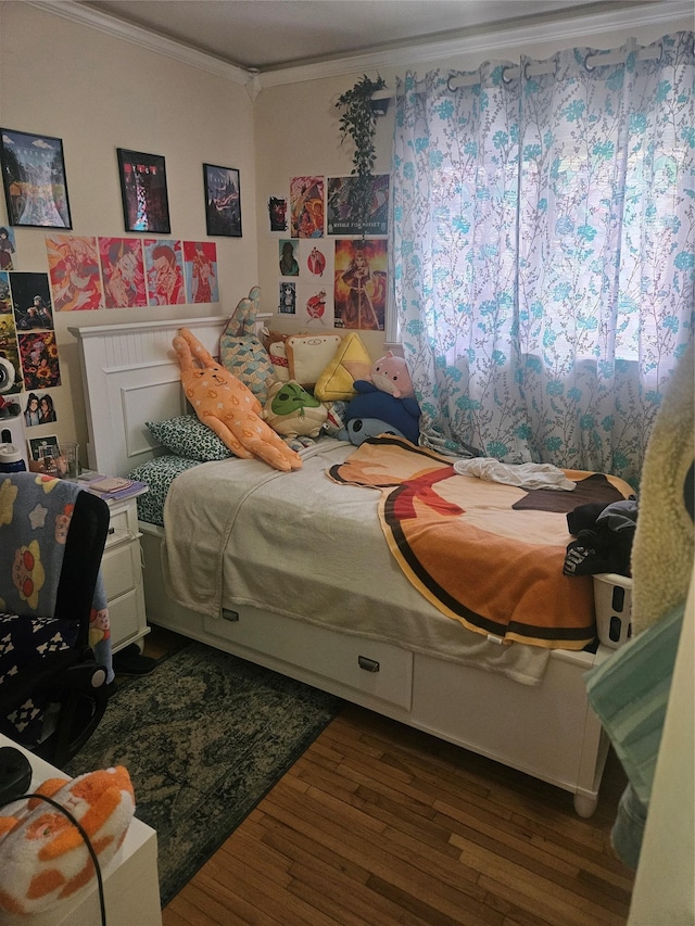 bedroom featuring ornamental molding and dark wood-type flooring