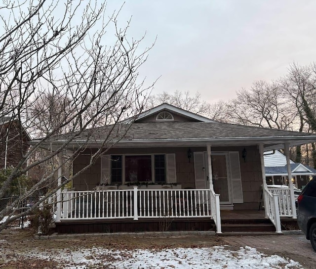 view of front of property featuring covered porch