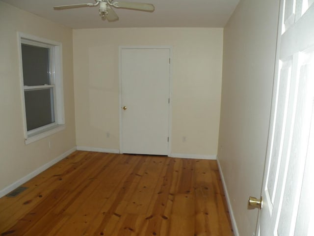 unfurnished room with ceiling fan and light hardwood / wood-style floors