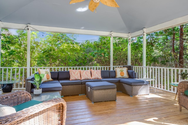 wooden deck featuring an outdoor hangout area and ceiling fan