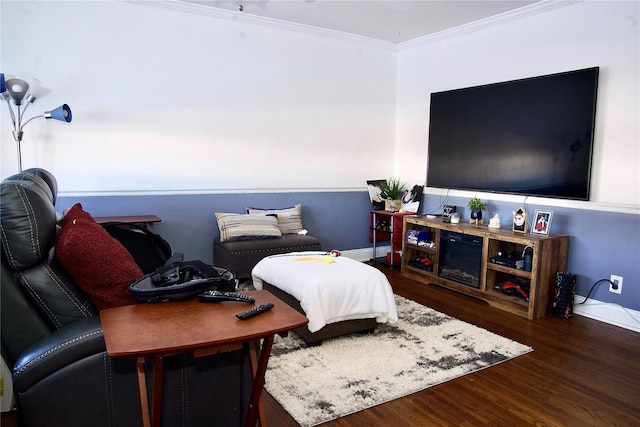 bedroom featuring ornamental molding and dark hardwood / wood-style floors