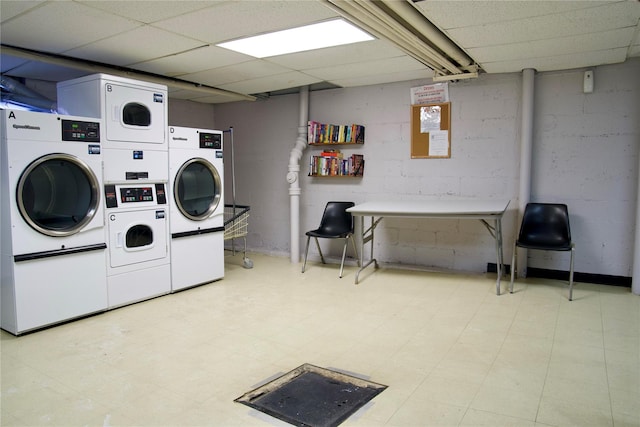 washroom with stacked washer / drying machine and washing machine and dryer