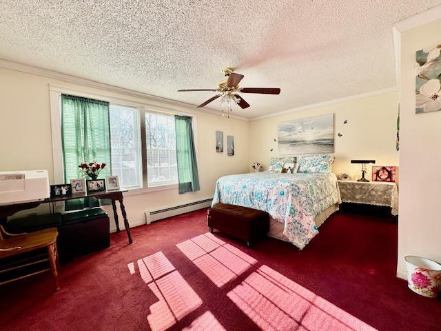 carpeted bedroom with a textured ceiling, a baseboard radiator, ornamental molding, and ceiling fan