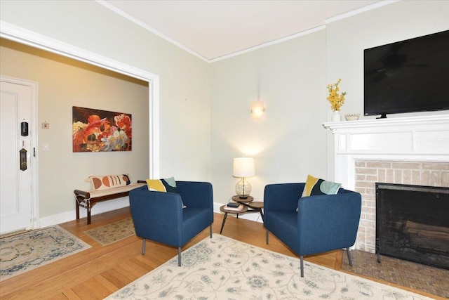 living room featuring ornamental molding, a brick fireplace, and wood-type flooring