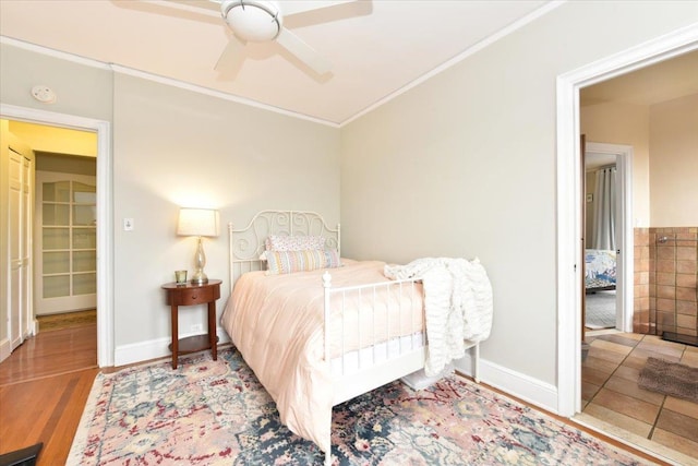 bedroom with crown molding, ceiling fan, and hardwood / wood-style flooring