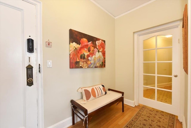 8 Barstow Rd Unit 7-E, Great Neck, NY 11021 - doorway to outside featuring crown molding, wood finished floors, and baseboards