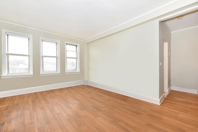 8 Barstow Rd Unit 7-E, Great Neck, NY 11021 - spare room featuring crown molding and light wood-type flooring