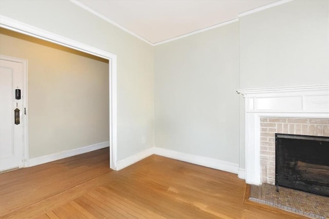 8 Barstow Rd Unit 7-E, Great Neck, NY 11021 - unfurnished living room with crown molding, a fireplace, and light wood finished floors