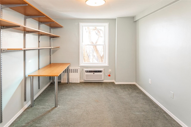 unfurnished office featuring radiator, baseboards, carpet flooring, and a wall mounted air conditioner