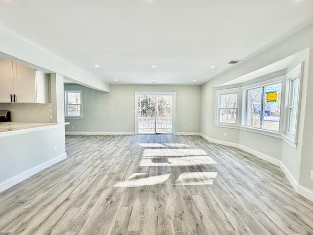 unfurnished living room featuring light hardwood / wood-style flooring