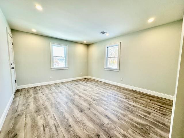 unfurnished room featuring light hardwood / wood-style flooring