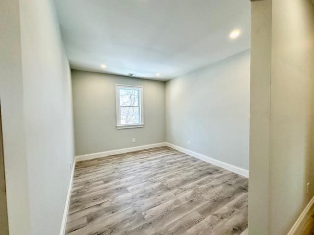 spare room featuring light hardwood / wood-style floors