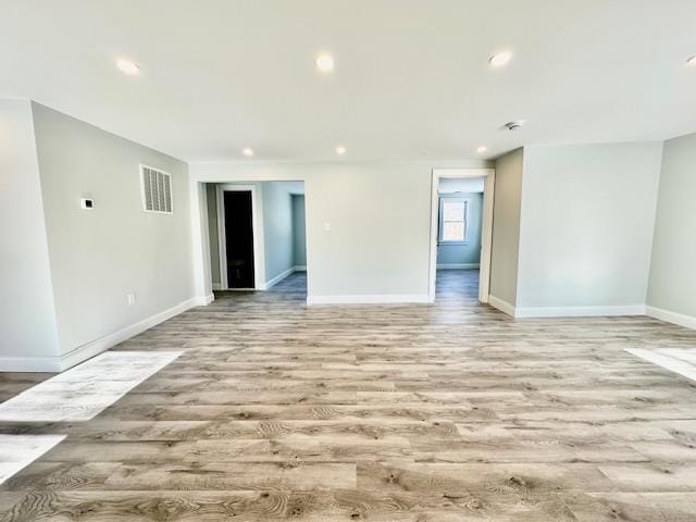 unfurnished room featuring light hardwood / wood-style flooring