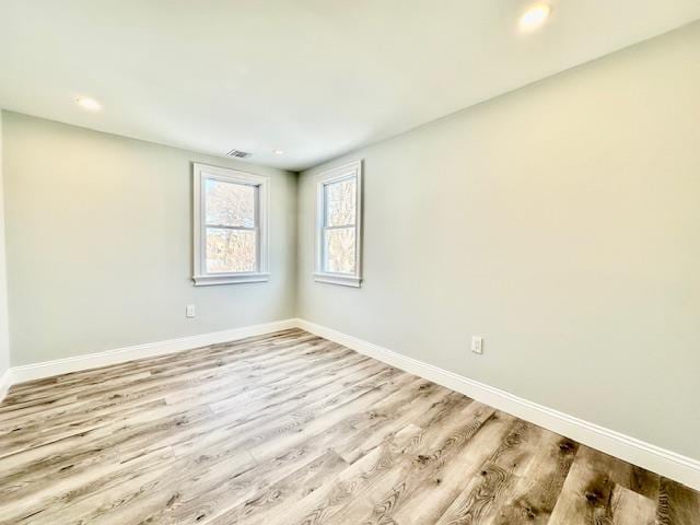 empty room with light wood-type flooring