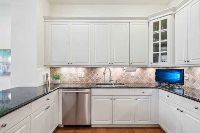 kitchen with dishwasher, sink, and white cabinets