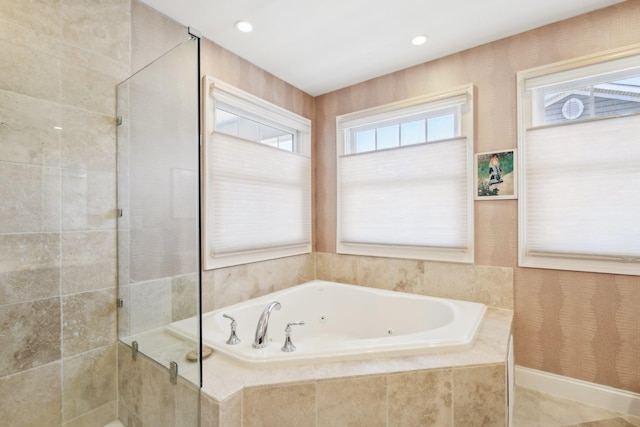 bathroom featuring shower with separate bathtub