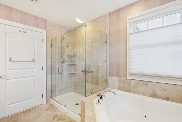 bathroom featuring tile patterned flooring and plus walk in shower