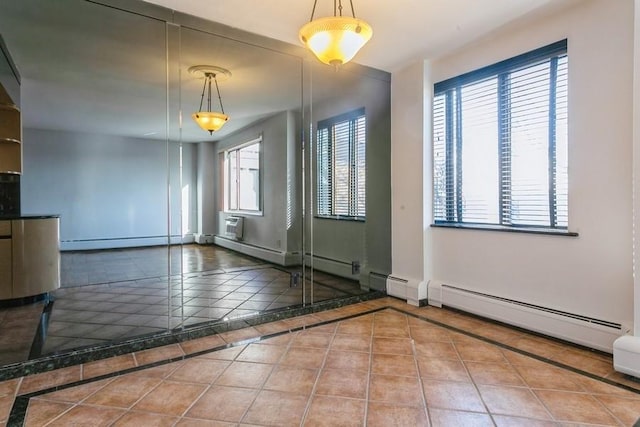 interior space featuring tile patterned floors and a baseboard heating unit