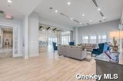 living room with light hardwood / wood-style flooring