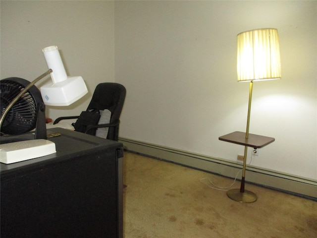 carpeted office with a baseboard heating unit