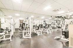 workout area with a paneled ceiling