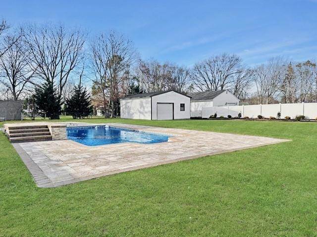 view of pool featuring an outbuilding and a yard