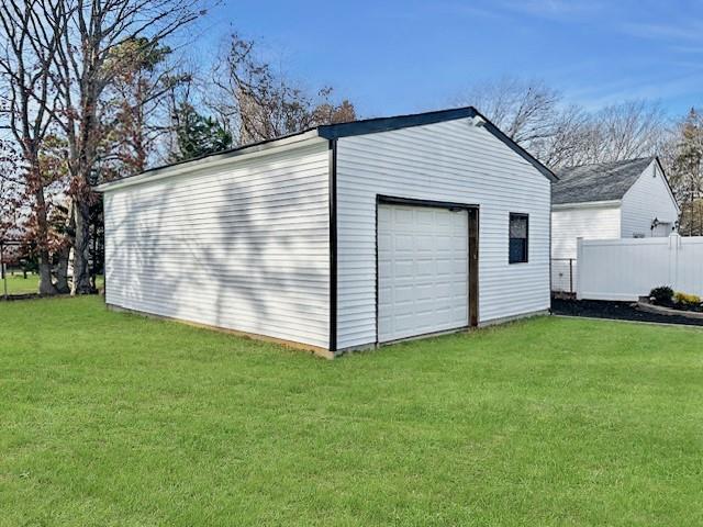 garage featuring a yard