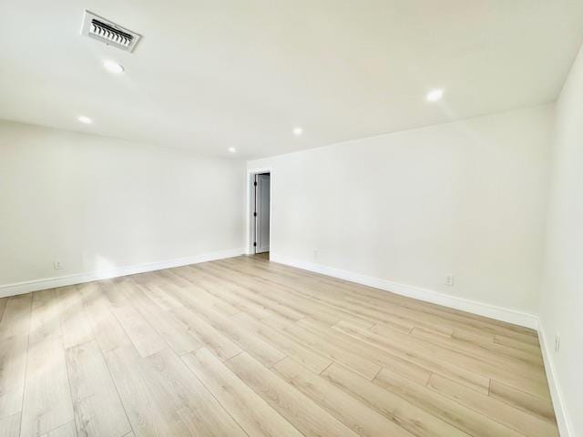 spare room with light wood-type flooring