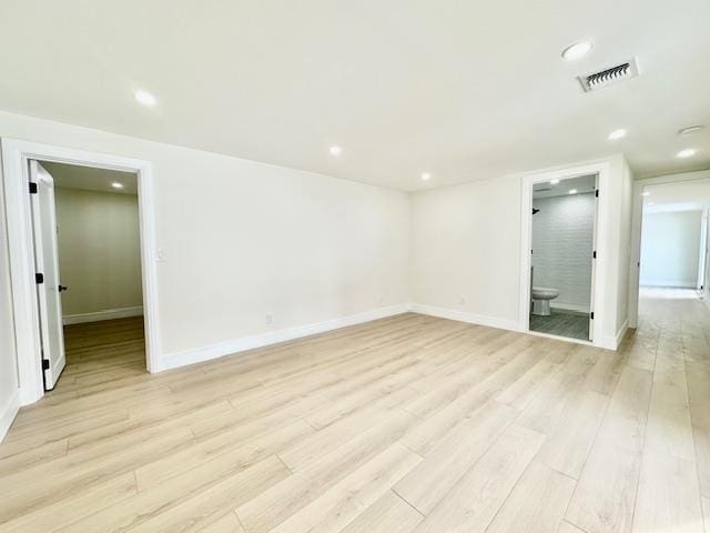 unfurnished room with light hardwood / wood-style floors