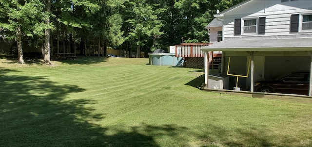 view of yard featuring a pool side deck