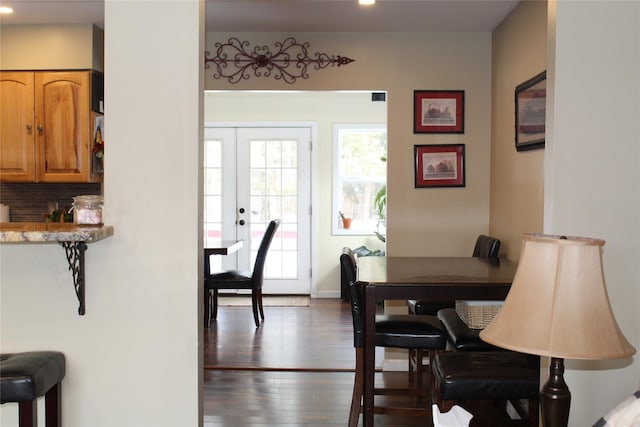 dining space featuring dark hardwood / wood-style flooring and french doors