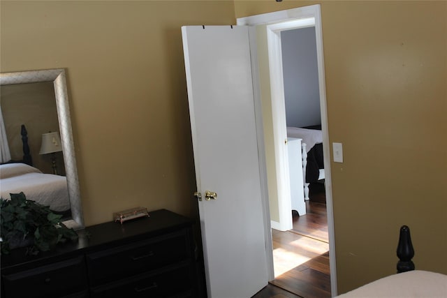 bedroom with hardwood / wood-style flooring