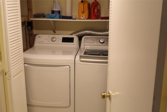 washroom with separate washer and dryer