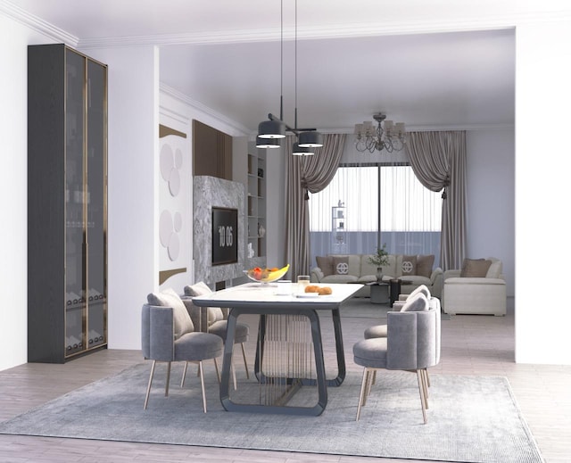 dining room featuring wood finished floors, an inviting chandelier, and ornamental molding