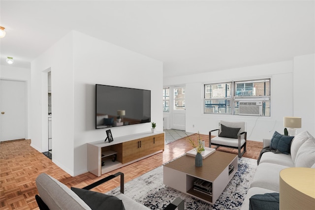 living room with light parquet flooring and cooling unit