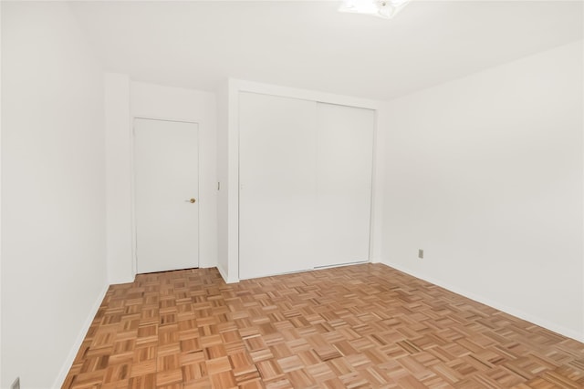 empty room with light parquet flooring