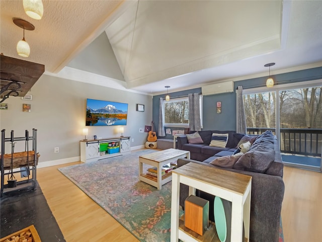 living room with crown molding, wood-type flooring, a wall mounted AC, and high vaulted ceiling