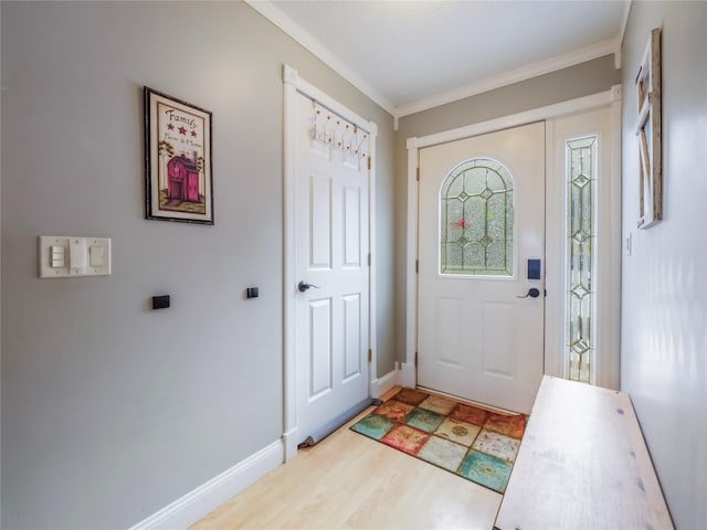 entryway featuring light hardwood / wood-style flooring and ornamental molding