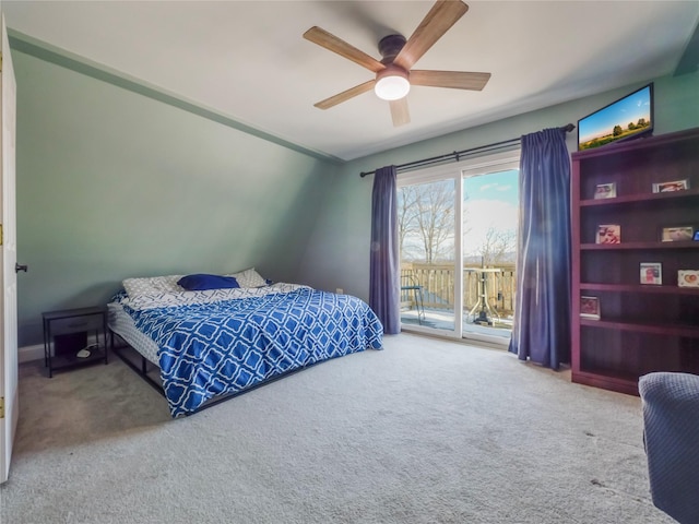 bedroom with access to outside, ceiling fan, and carpet