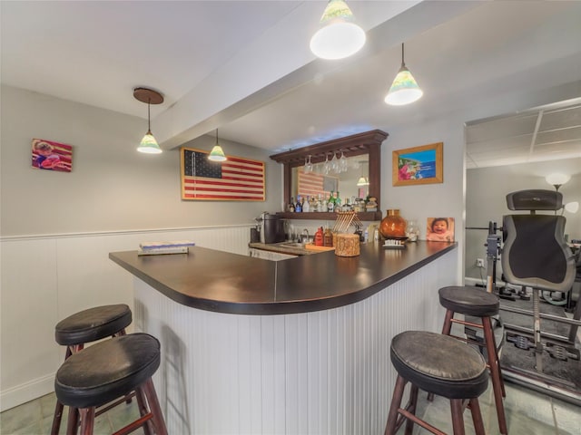 bar with pendant lighting and sink