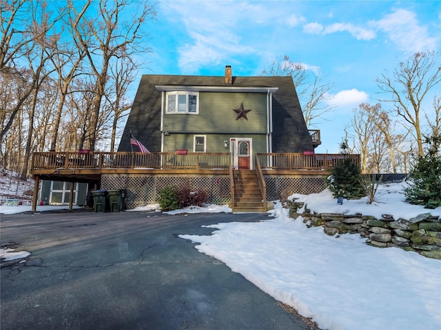 view of front of property with a wooden deck