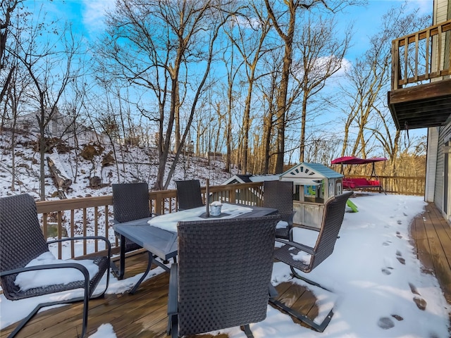 view of snow covered deck