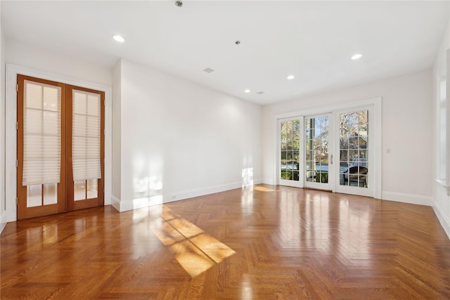 spare room with french doors and parquet flooring