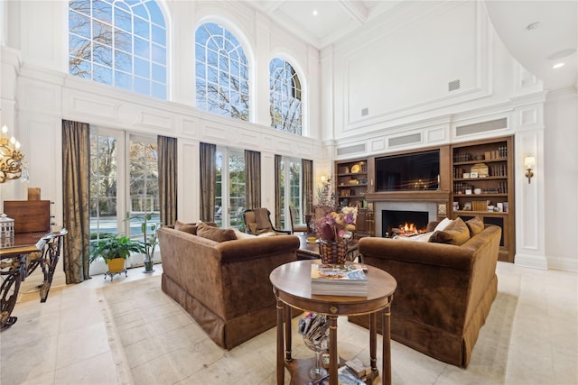 living room featuring built in features, beamed ceiling, coffered ceiling, light tile patterned floors, and crown molding