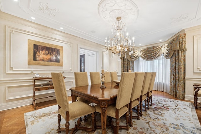 dining area featuring ornamental molding, light parquet flooring, and a notable chandelier