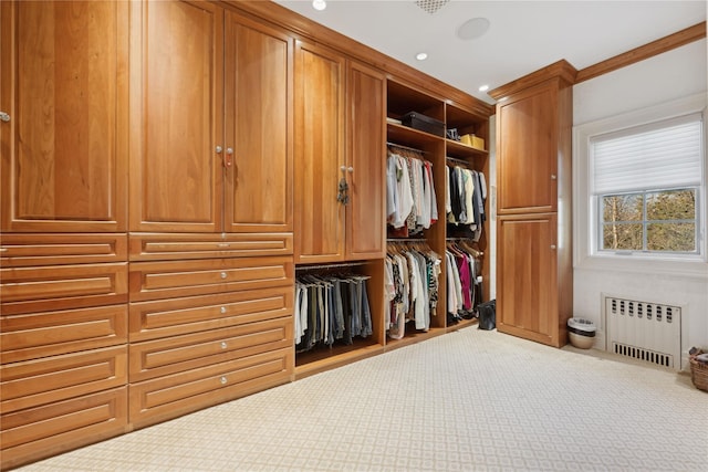 spacious closet featuring radiator