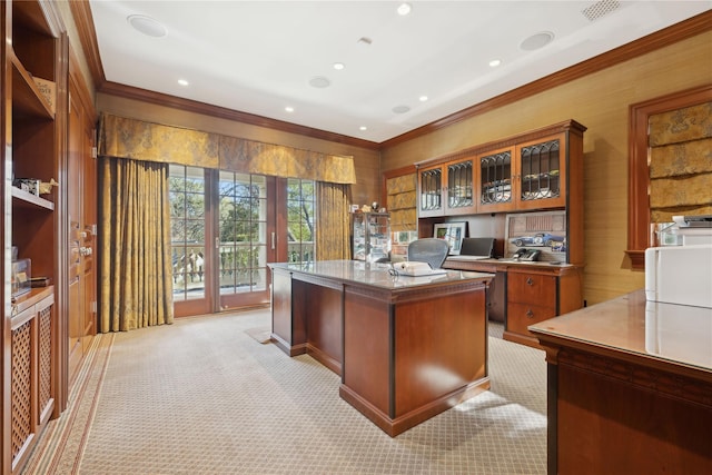 carpeted home office featuring crown molding